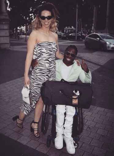 Ade Adepitan with his wife in a vacation. net worth earning, inocme